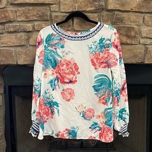 White, blue, pinkish, and teal blouse. Size XL.
